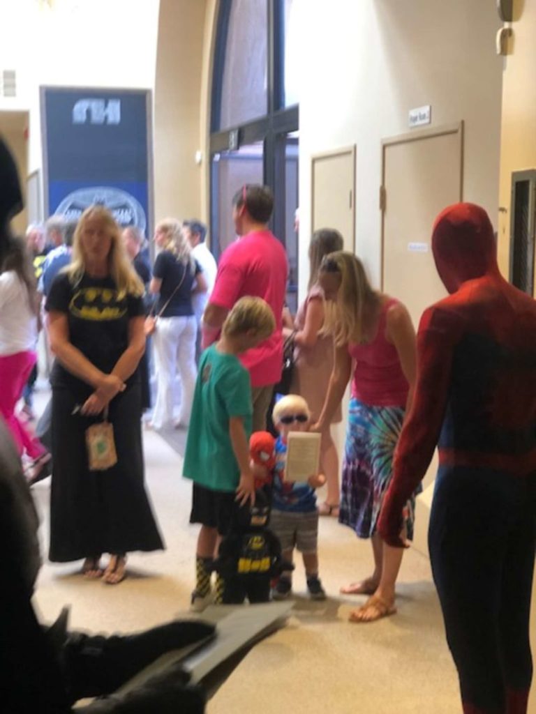 superheroes welcoming attendees