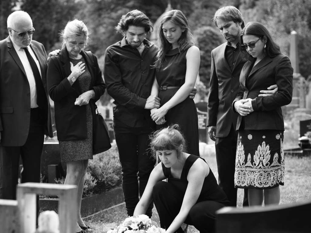 Loved Ones Gathering Around Burial Site | Eternally Loved